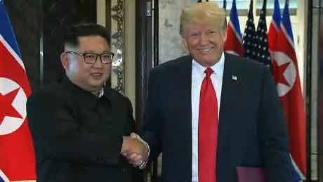 Kim and Trump Shake Hands